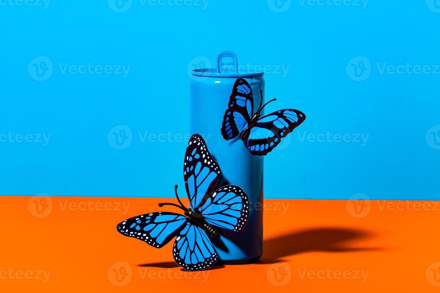 A blue and orange container with two butterflies on it photo