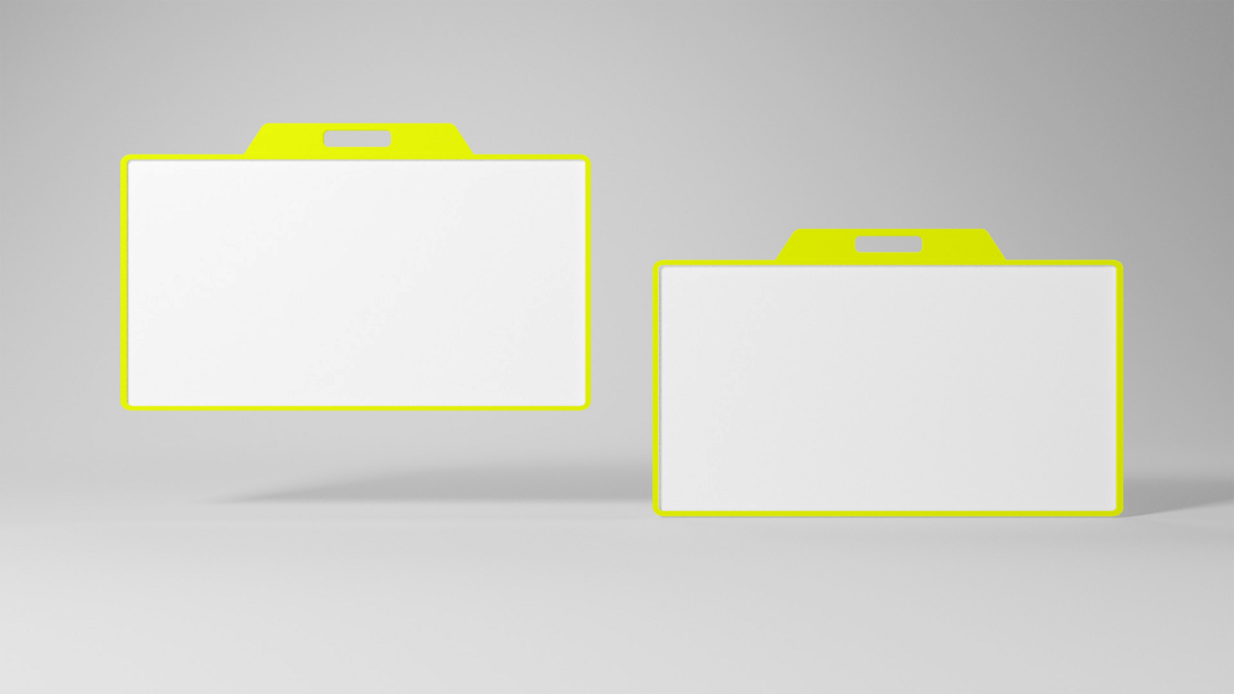 Two white and yellow plastic file folders on a gray surface psd