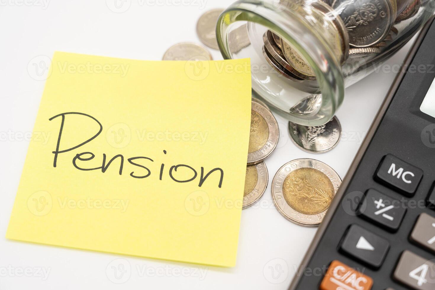 PENSION text on sticky note. Thai Baht Coins spilled out of jar glass isolated on white background. photo