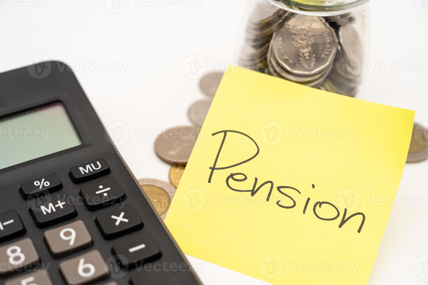 PENSION text on sticky note with Calculator. Thai Baht Coins spilled out of jar glass isolated on white background, saving for future. photo