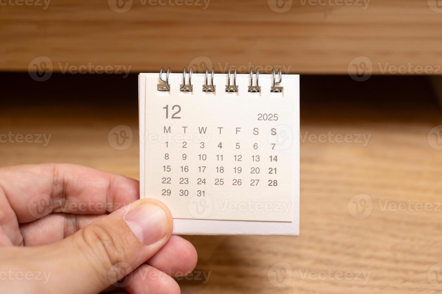 Desk Calendar for DECEMBER 2025 background. Calendar concept with 2025 DEC calendar on wooden background. photo