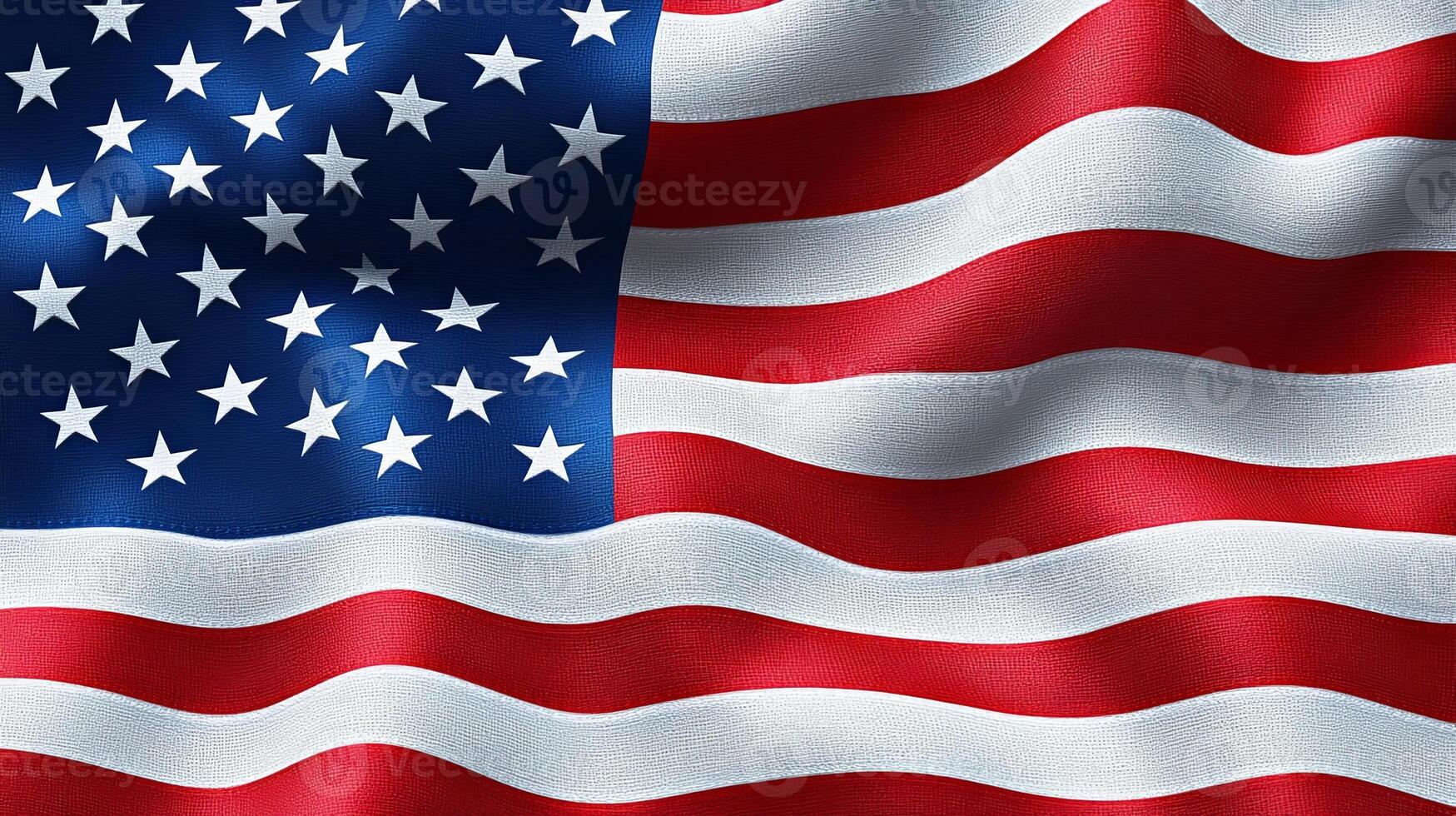 Waving United States flag displaying red and white stripes along with blue field of stars in clear daylight photo