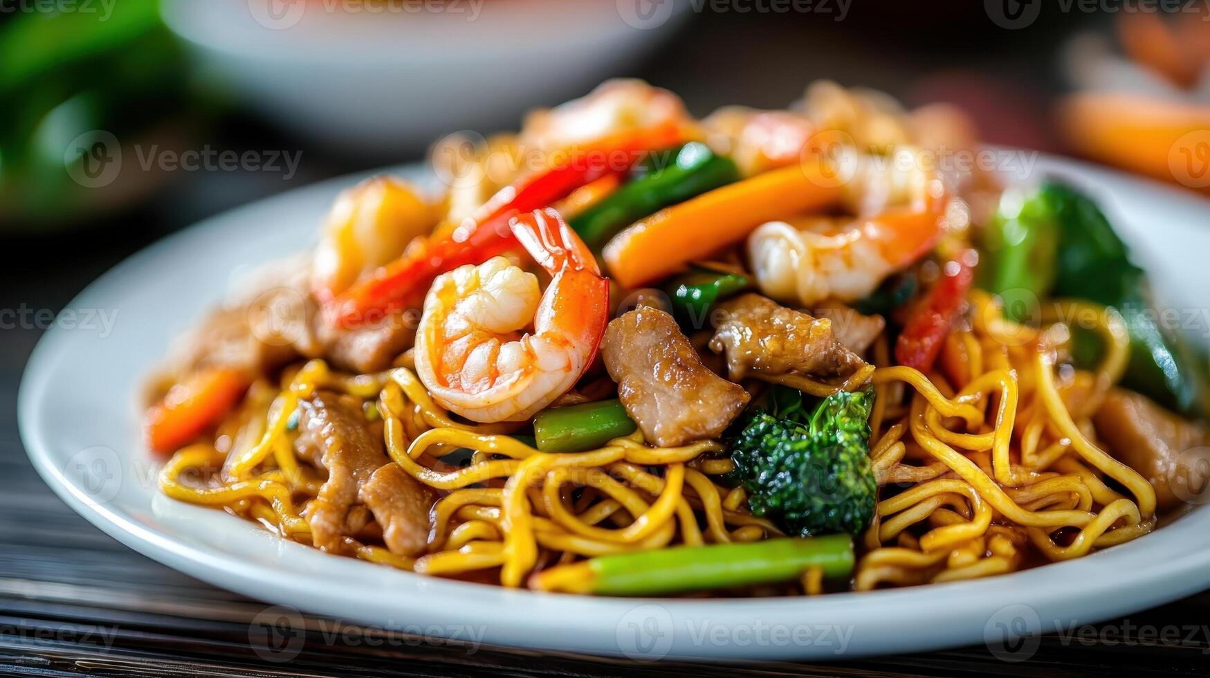 Delicious shrimp stir-fry with colorful vegetables served over a bed of golden fried noodles in a vibrant presentation photo