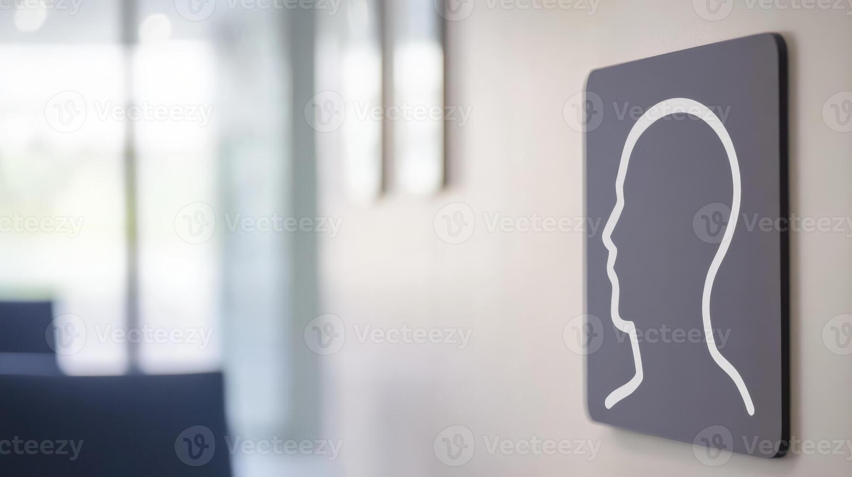 Sign indicating an area for quiet reflection in a modern building located in an urban environment, featuring a minimalist design with a human profile outline photo