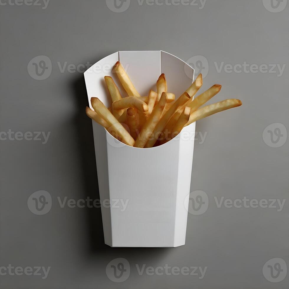 French fries in a paper box on a gray background photo