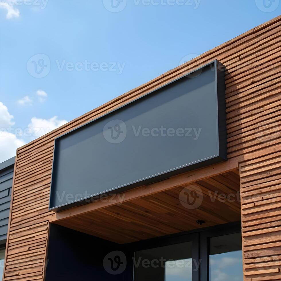 A large black sign on the side of a building photo