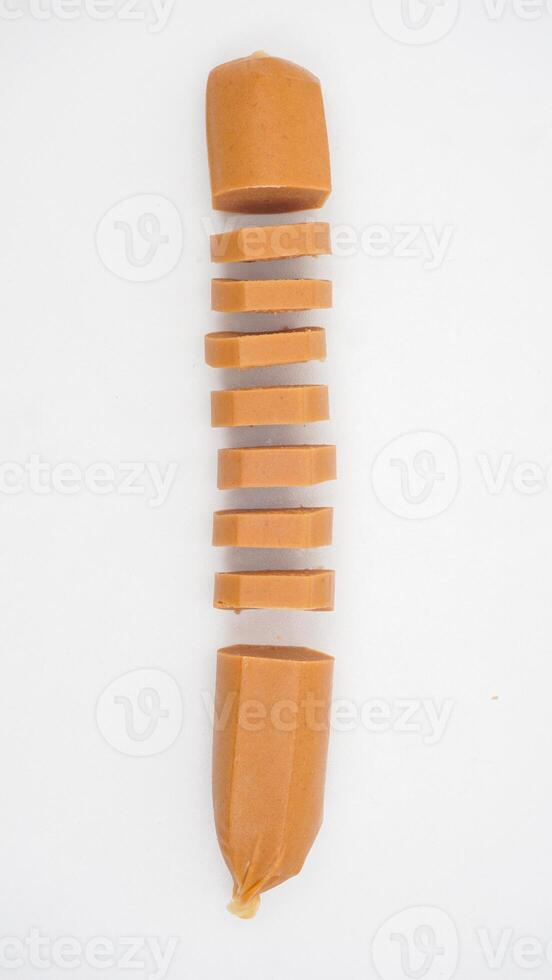Top view of raw sausage slices isolated on white background photo
