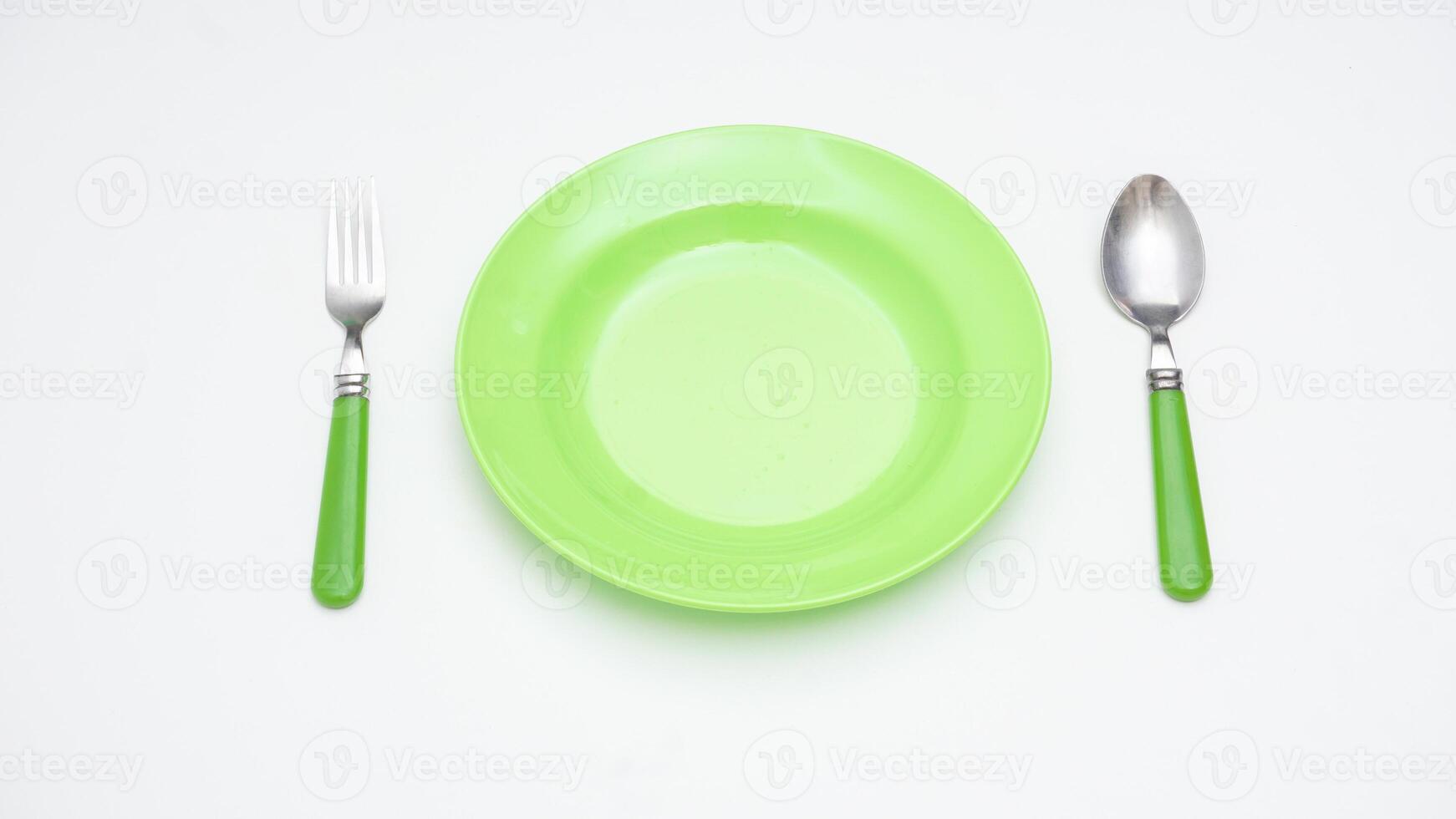 Stainless Steel Spoon, Fork, and Plate Isolated on White Background photo