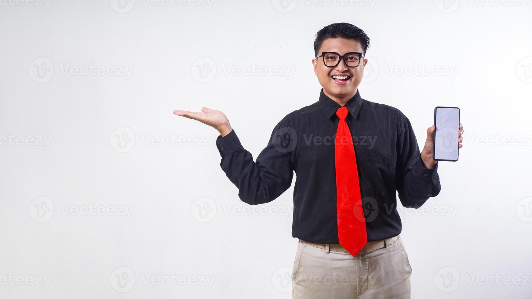 Smiling Asian employee business man corporate wearing formal clothes holding mobile cell phone with blank screen mock up for advertisement isolated on white background photo