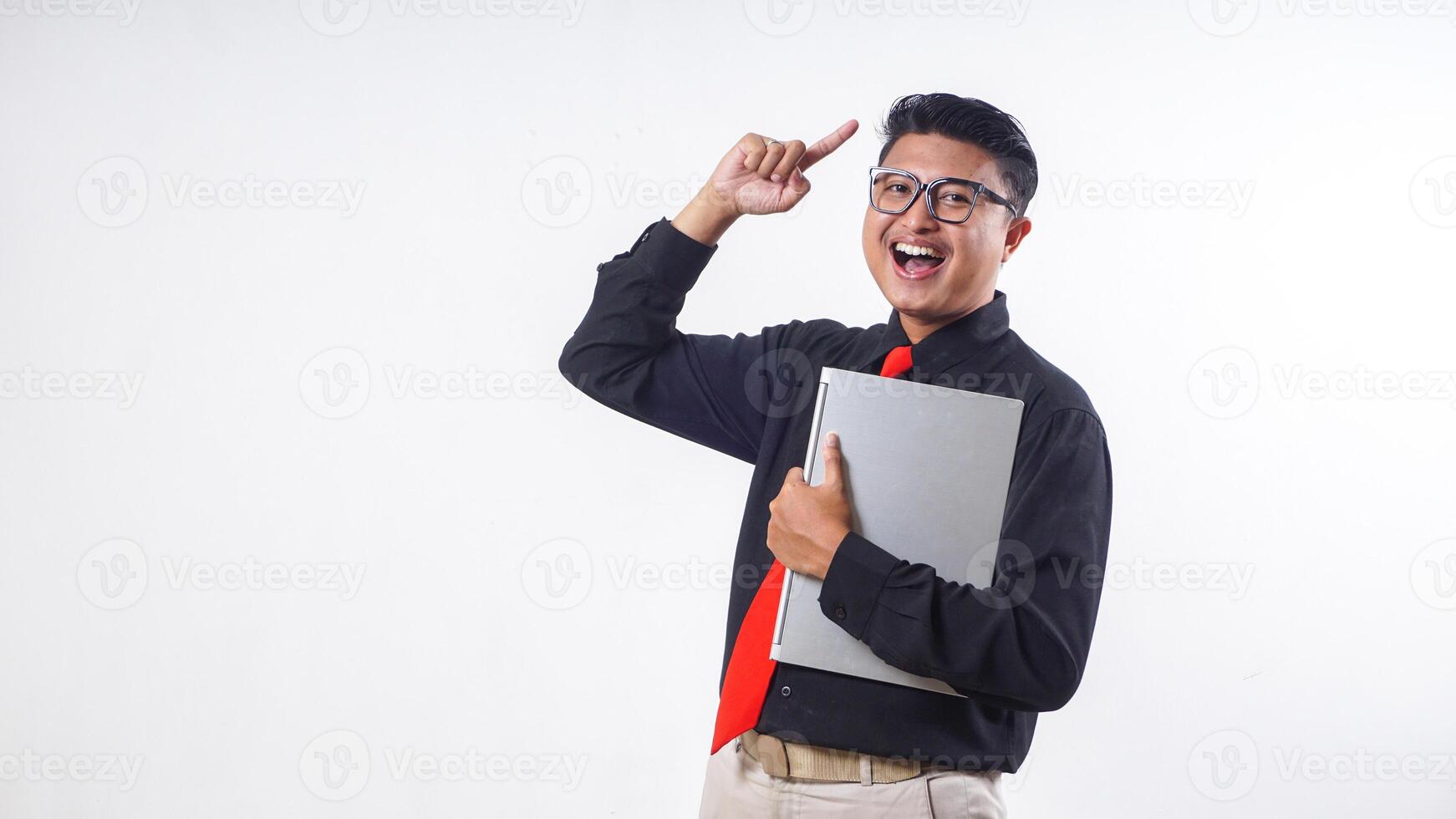 Portrait of confident Asian employee businessman corporate wearing formal clothes got good idea while holding laptop isolated on white background photo