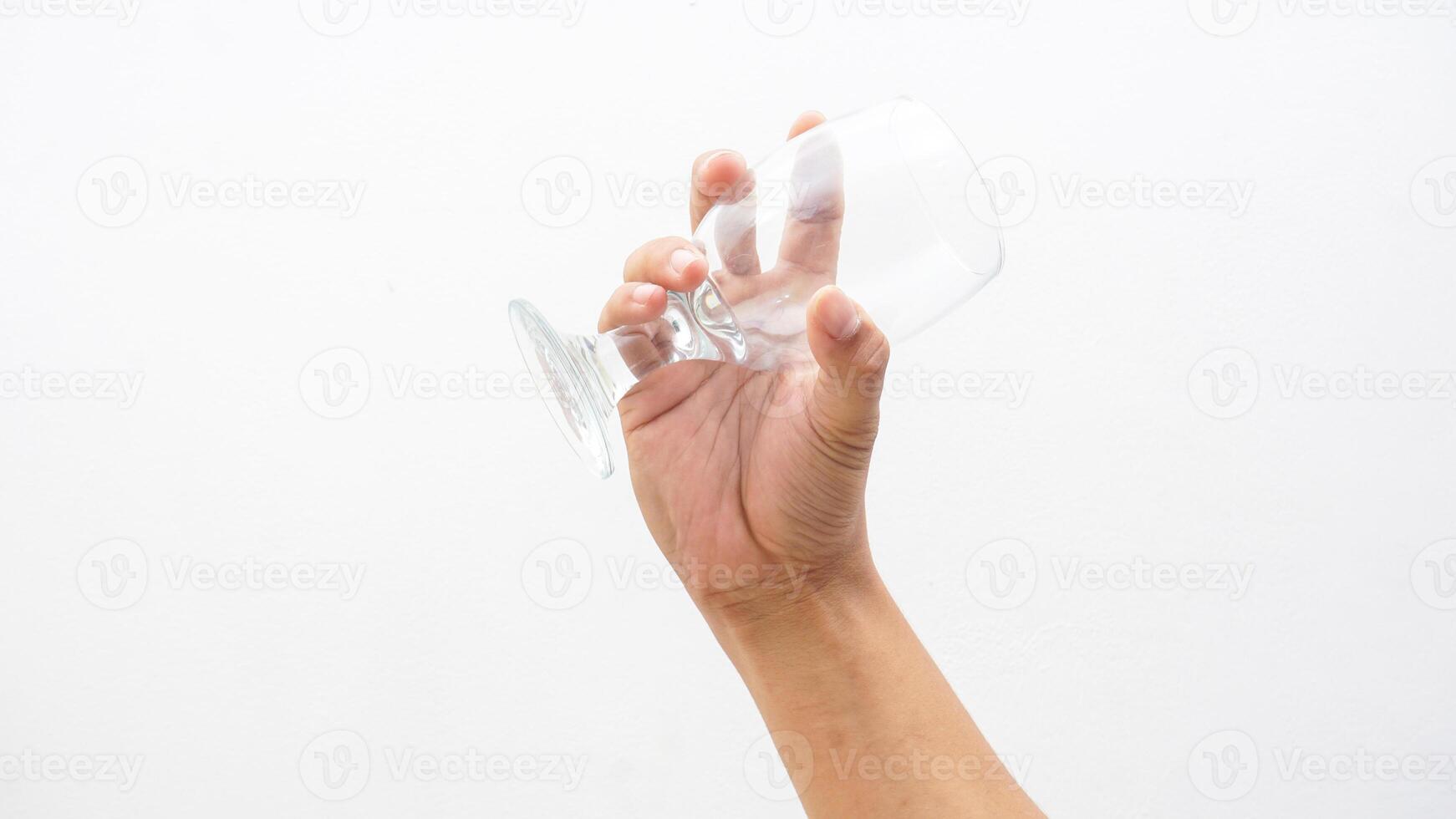 Hand of Man Holding Glass Isolated on White Background photo