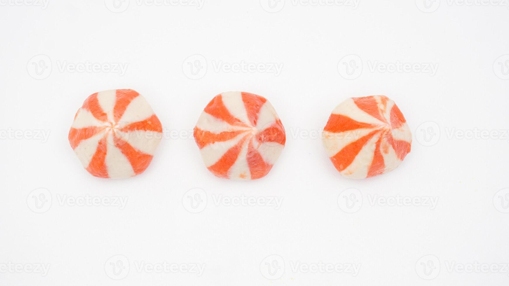 Orange stripped raw fish dumpling ball stuffed with chicken meat isolated on white background photo