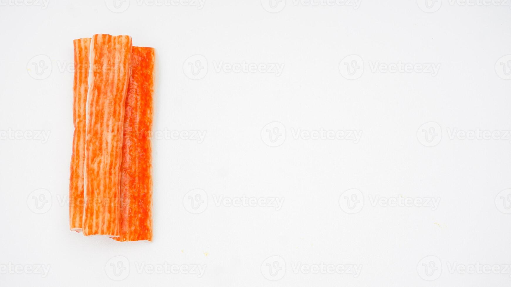 Raw crab stick made from processed fish isolated on white background photo