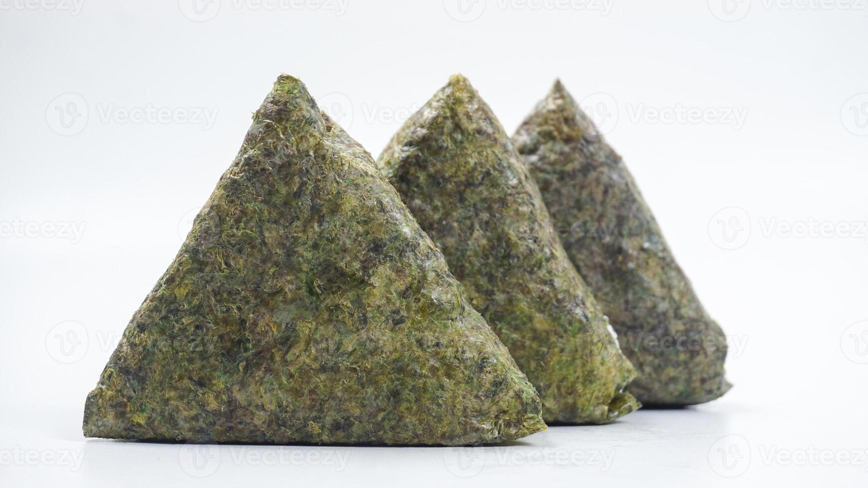 Triangular rice ball wrapped in nori isolated on white background photo