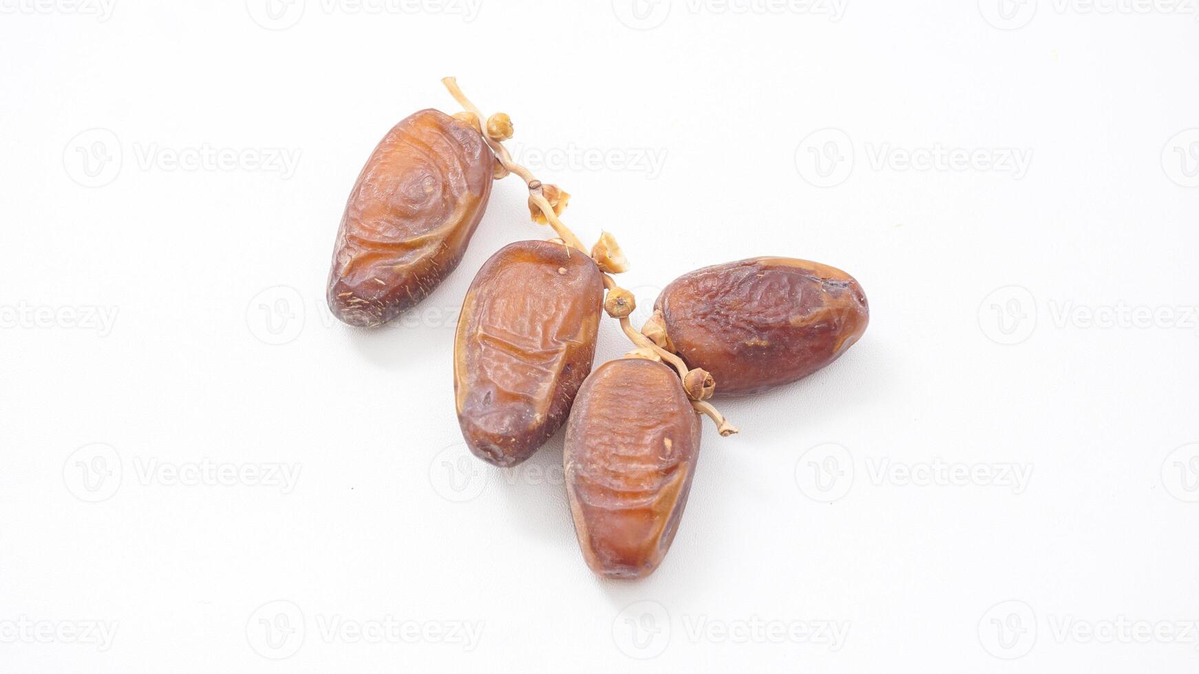 Sweet Delicious Dates Fruit Isolated on White Background photo