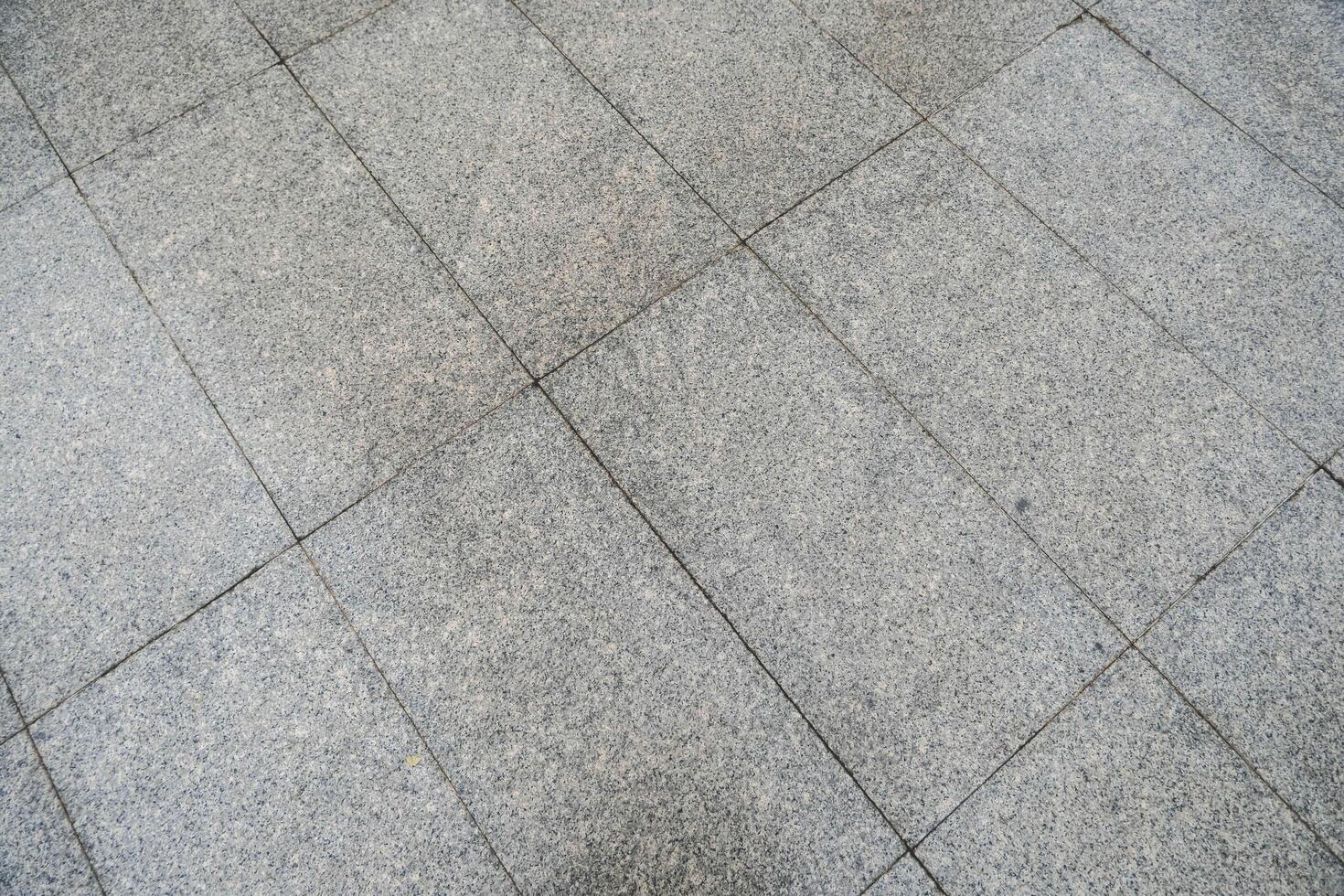 Grey tile floor, tile background photo