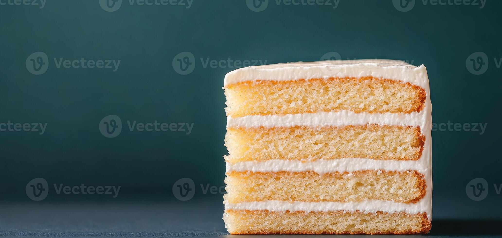 Delicious homemade cake slice with creamy frosting and layered texture, showcasing close up view of its soft sponge and smooth icing, perfect for dessert lovers photo