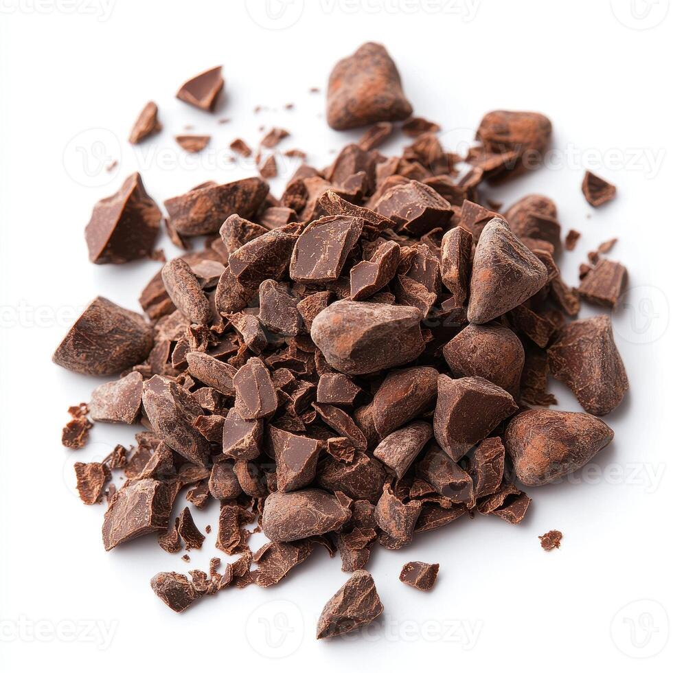 Rich cocoa nibs scattered on white background, perfect for chocolate lovers and baking enthusiasts. These raw chocolate ingredients add depth to desserts and snacks photo
