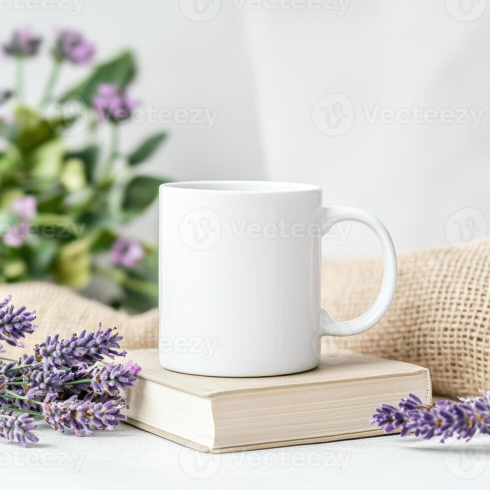 bright white mug placed on stack of books, surrounded by lavender flowers, creating serene and cozy atmosphere. Perfect for enjoying warm beverage photo