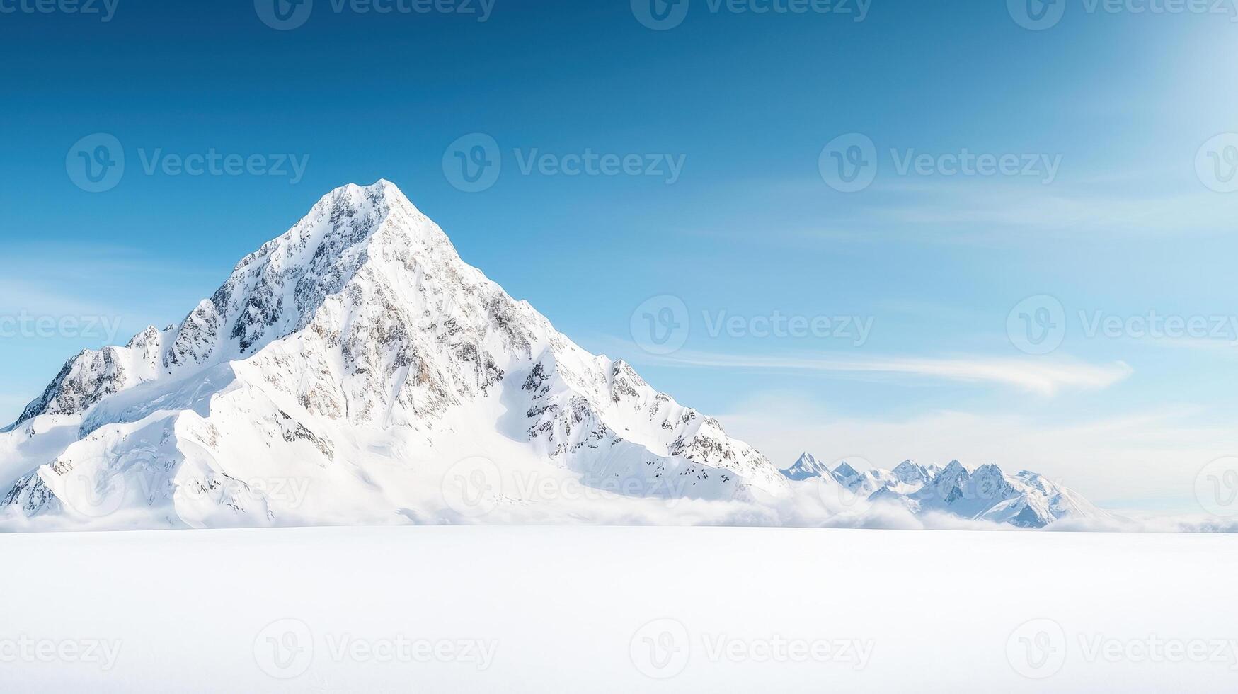 Majestic snow capped mountains rise against clear blue sky, creating breathtaking landscape that evokes sense of tranquility and awe. vast expanse of snow adds to serene beauty of scene photo