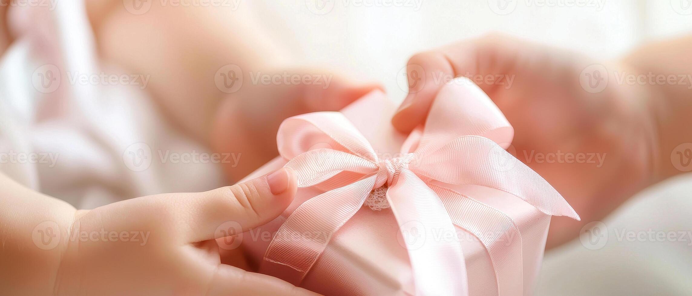 touching moment of child receiving beautifully wrapped gift symbolizes love and joy during mother day celebration photo