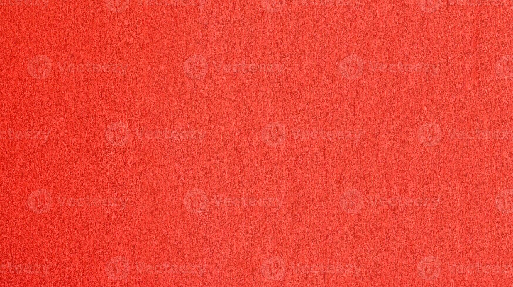 Red colored paper texture background with detailed surface photo