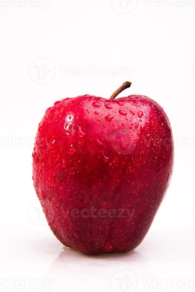 A red apple with water droplets on it photo
