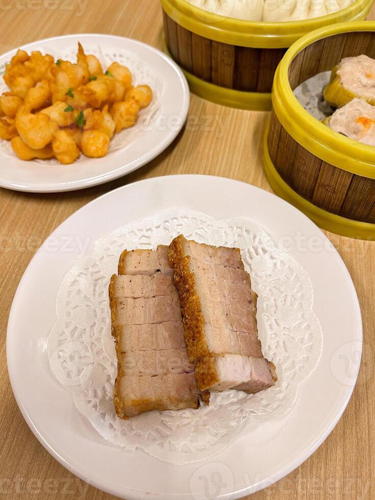 A table with two plates of food and a bowl of rice photo