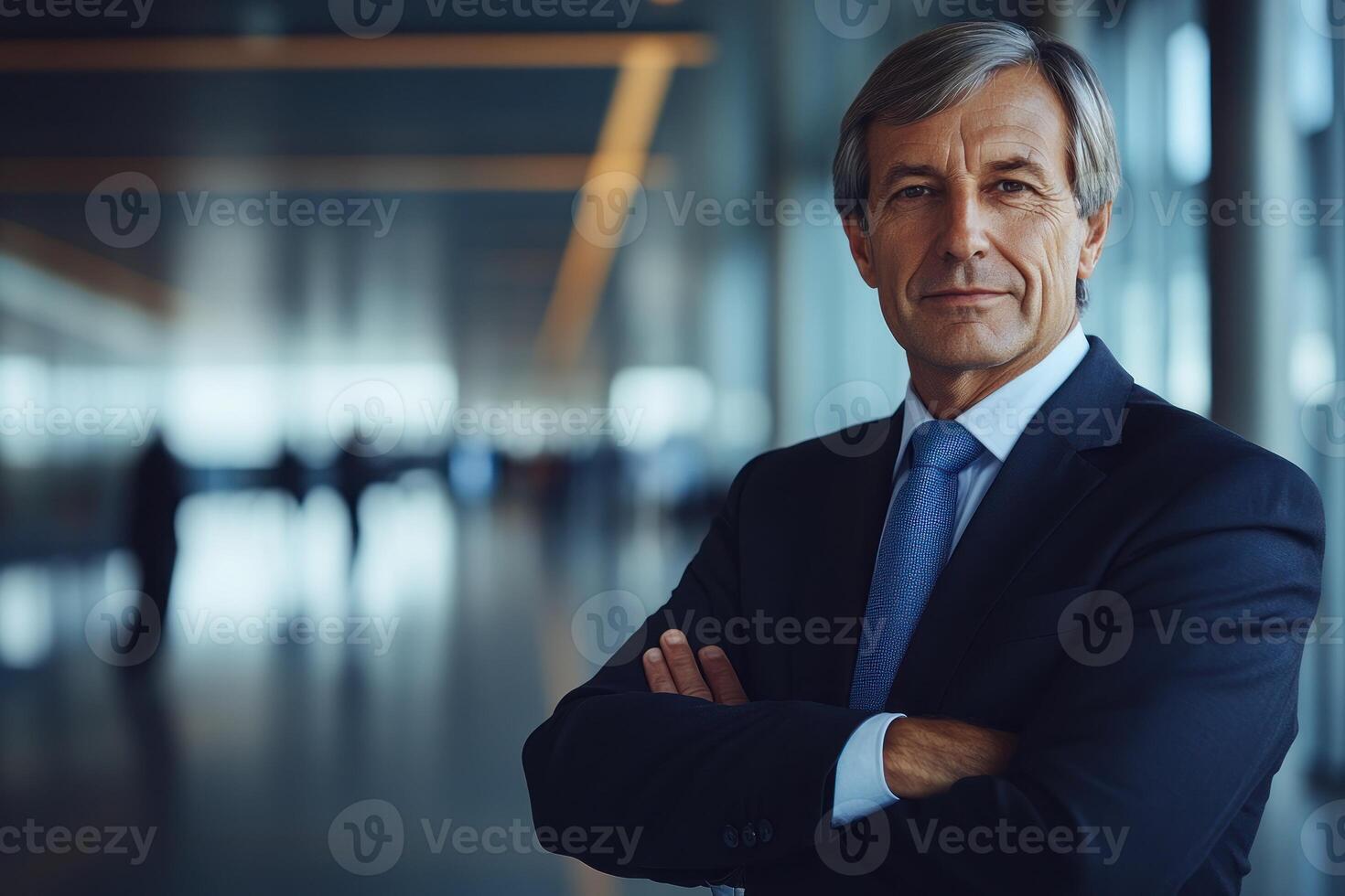 Business executive poses confidently in modern office setting with blurred background photo