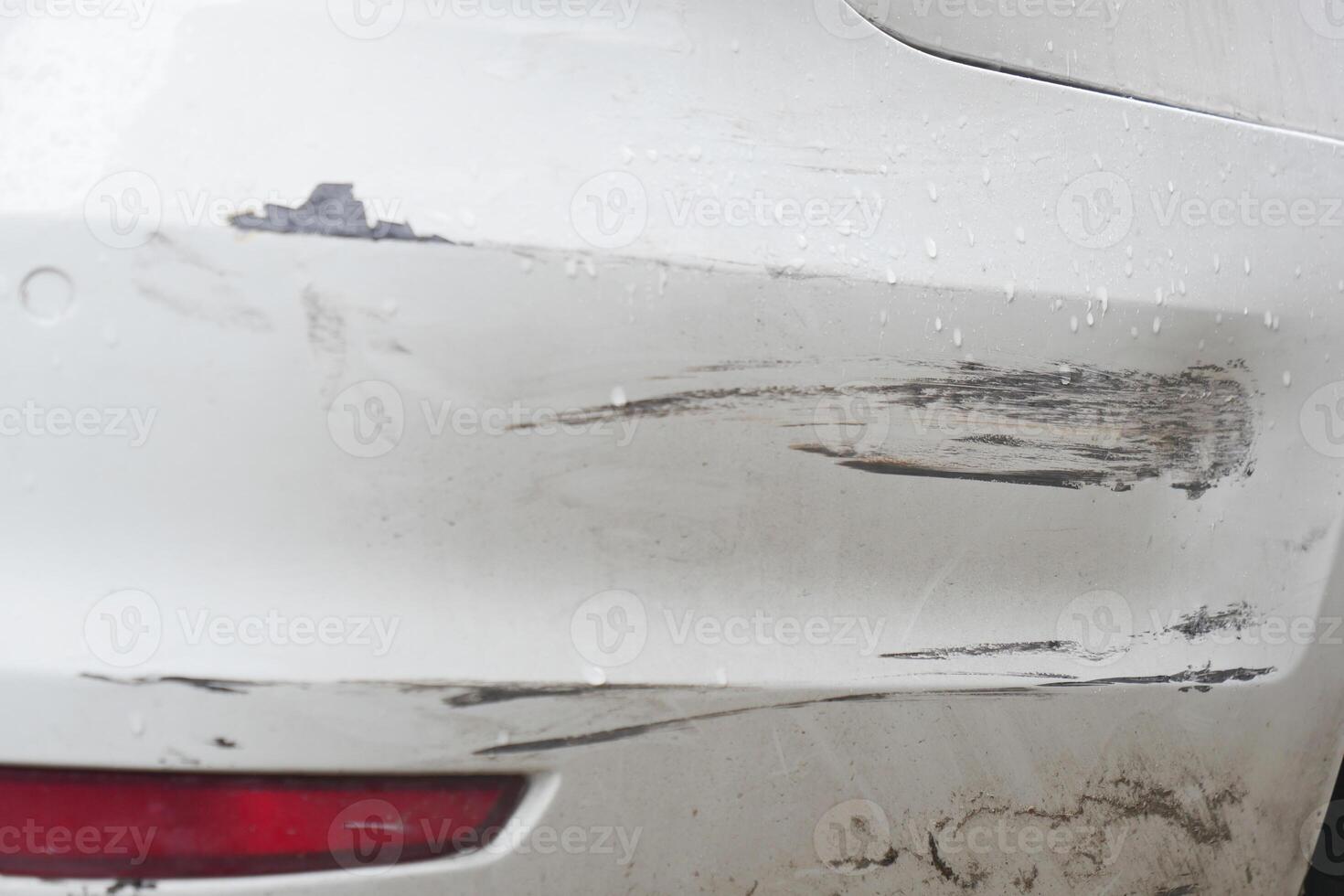 Car bumper with scratches and scuff marks after minor collision photo