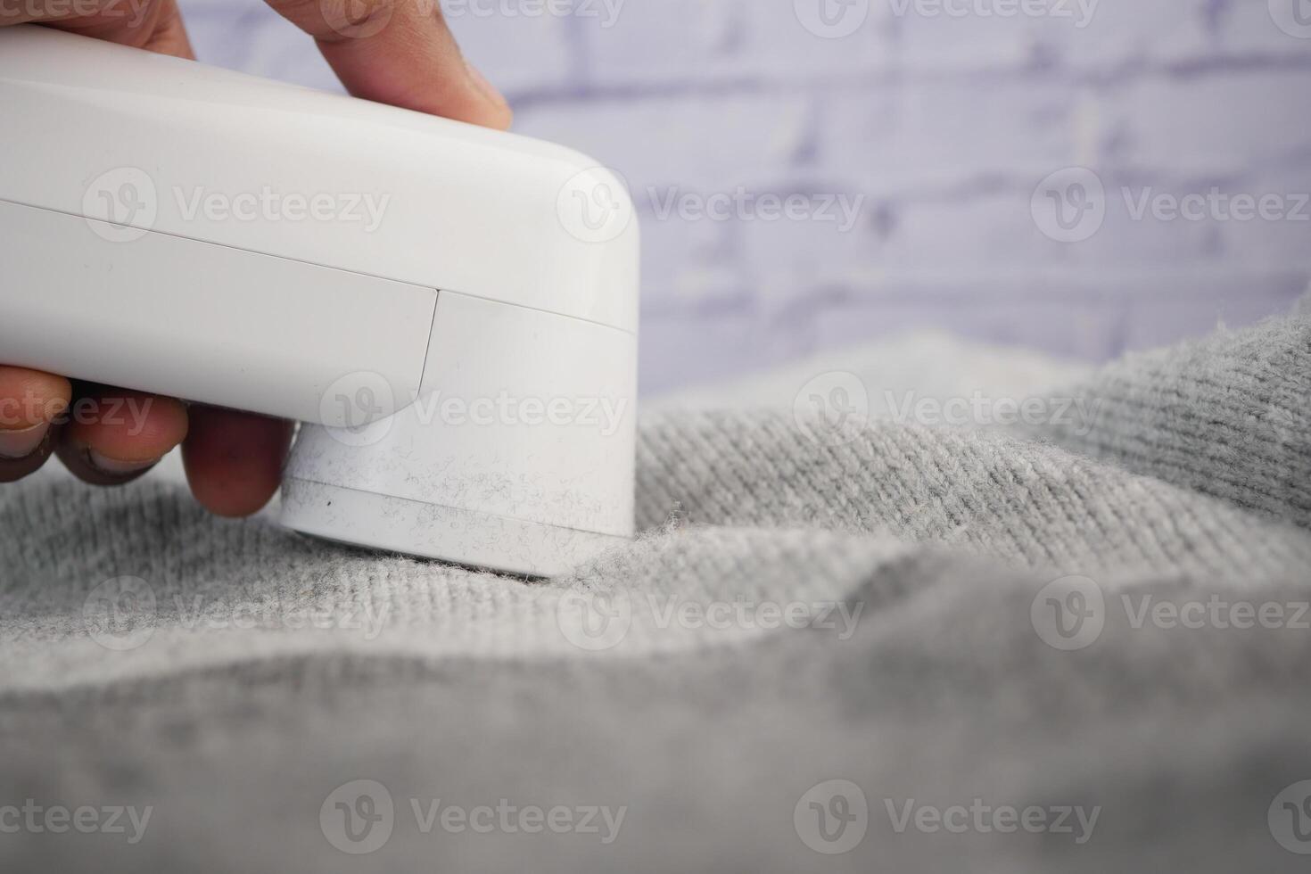 How to effectively remove lint from clothing using a lint remover photo