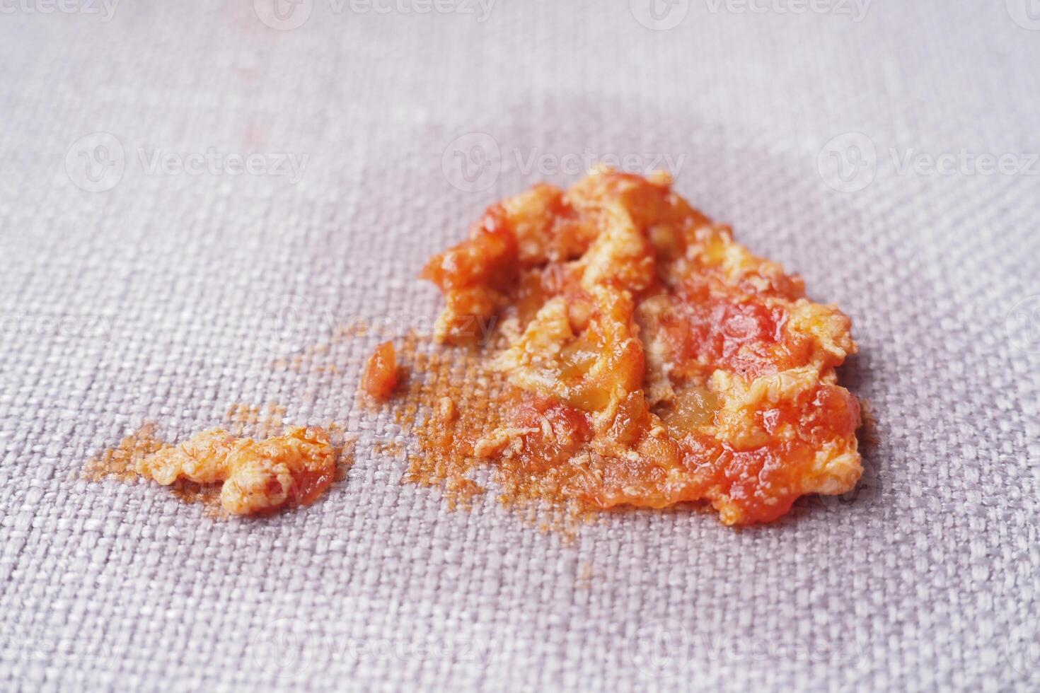 Spilled tomato sauce mixture on a textured kitchen surface photo