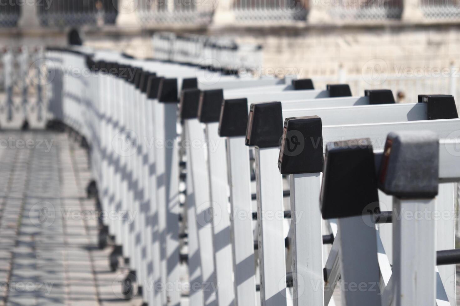 Railing along a scenic walkway in a historic city photo