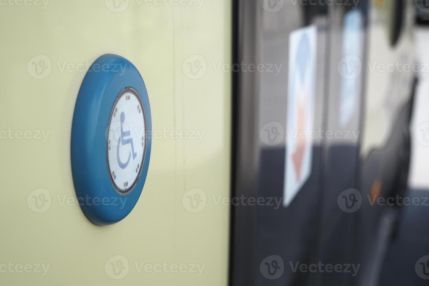 Accessible transportation button on bus for wheelchair users photo