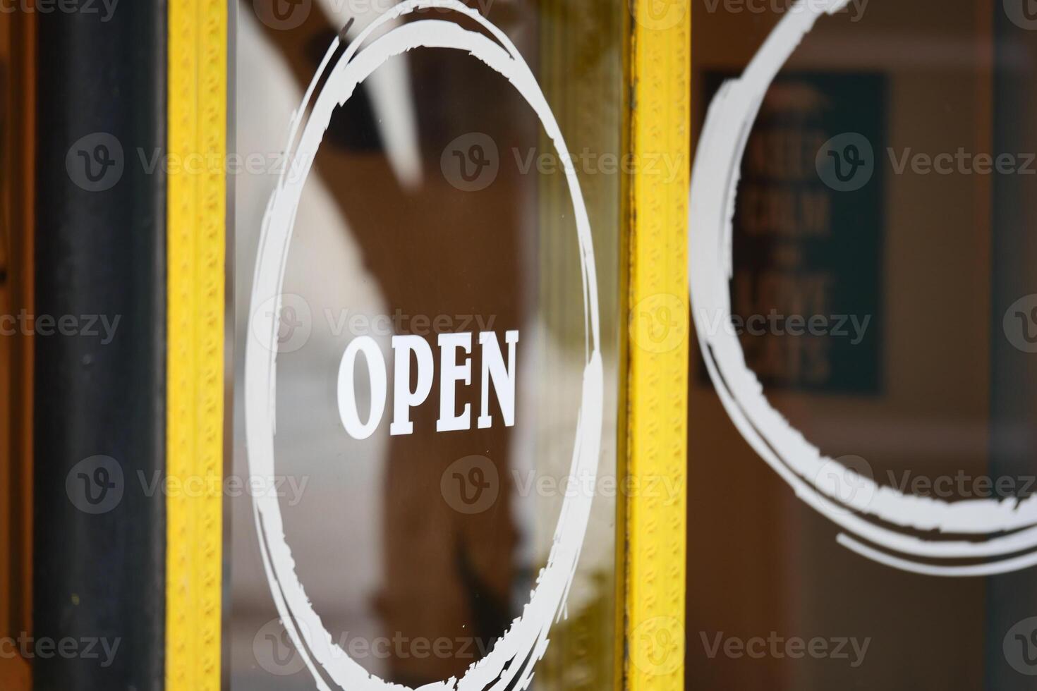 Open door welcoming visitors to a lively establishment in the city photo