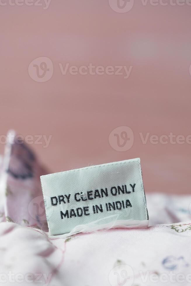 Label showing dry clean instructions on fabric made in India photo