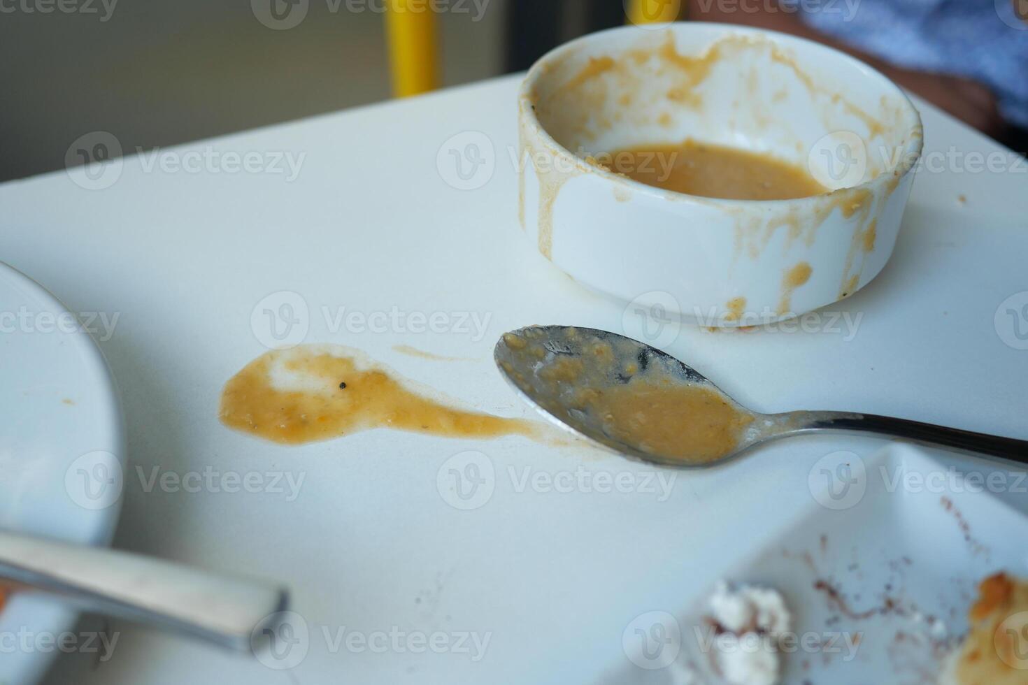 Dessert remnants on a table after a casual meal with friends photo