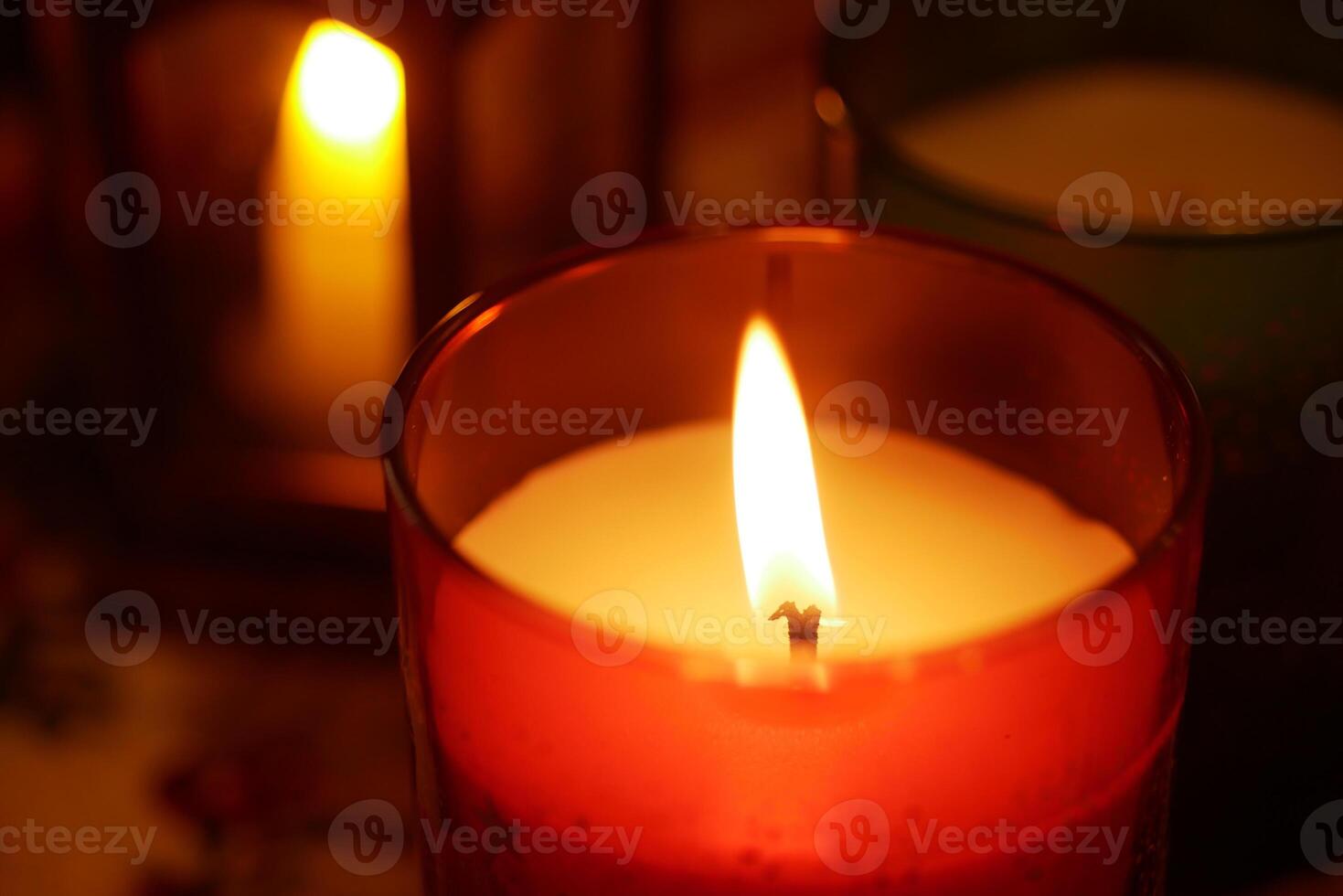 Warm glow from candles illuminating a cozy indoor setting photo