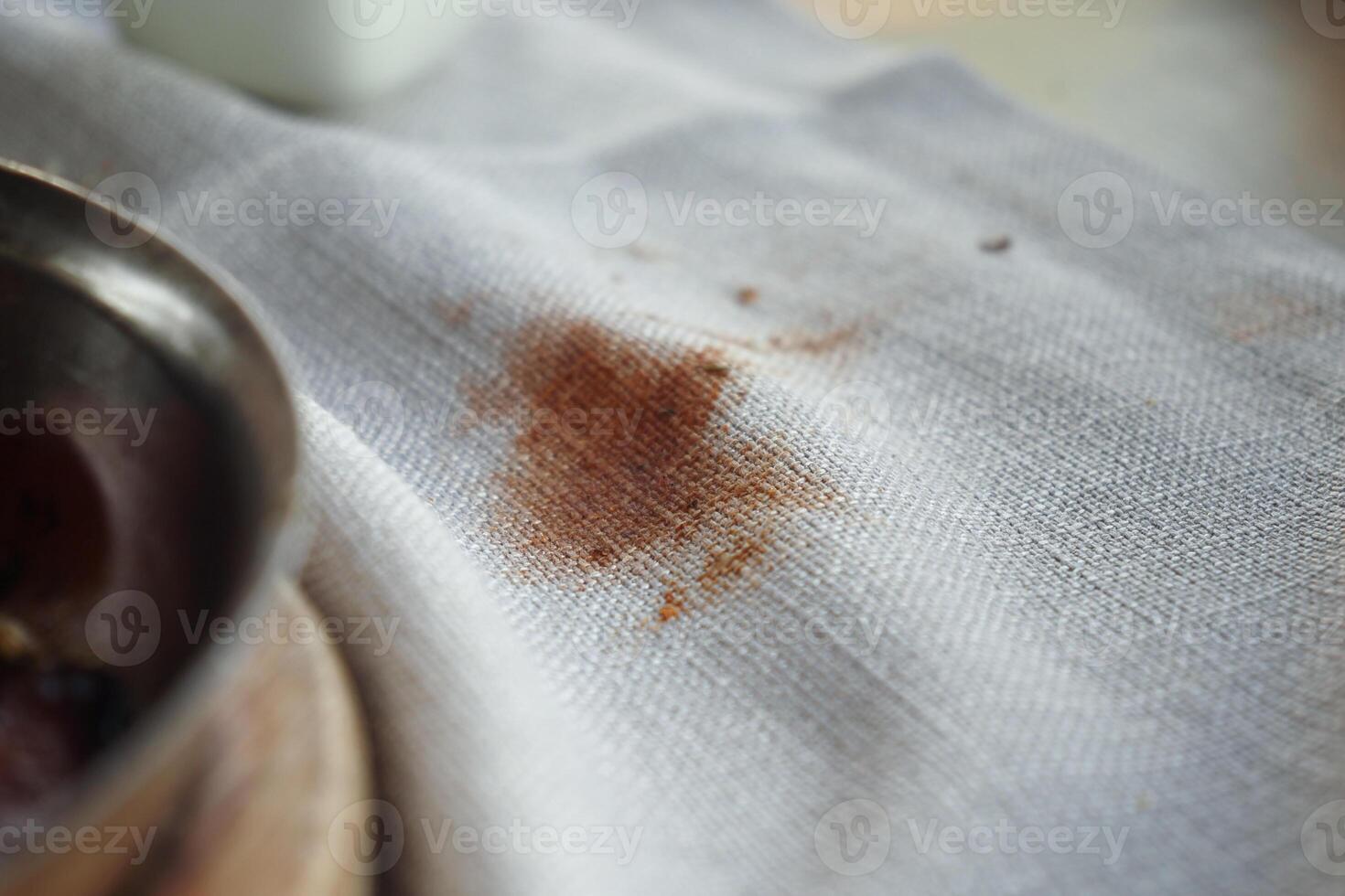 Stains on a white tablecloth from food and drink during a meal photo