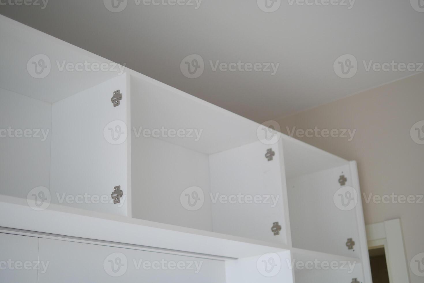 Modern white shelving units in a minimalistic interior design photo