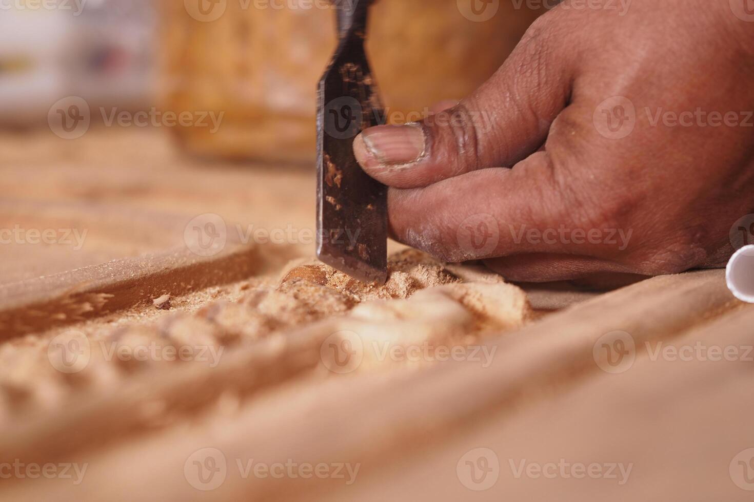 Crafting intricate woodwork in a workshop during daylight hours photo