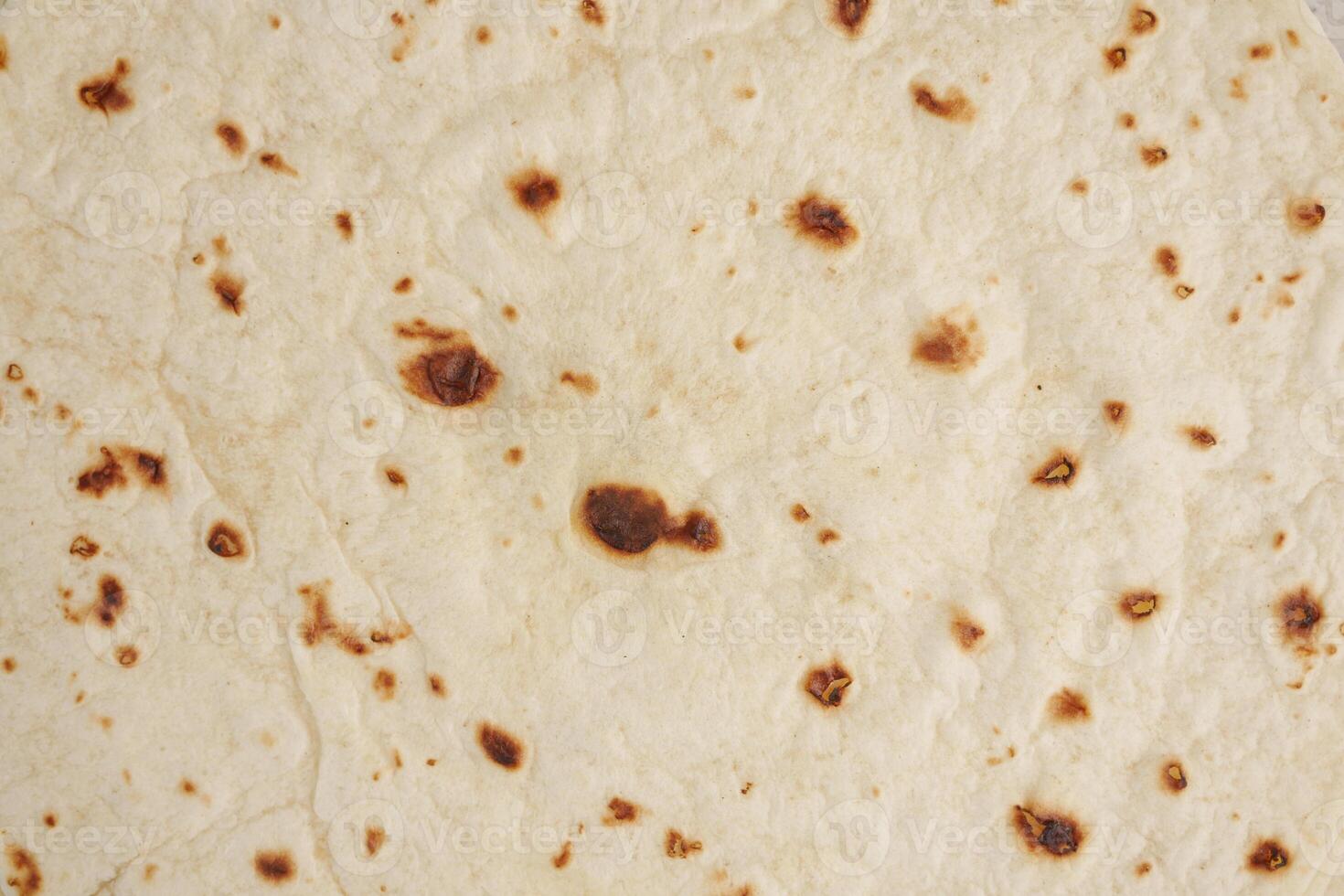 Homemade capati freshly cooked on a hot surface for meals photo
