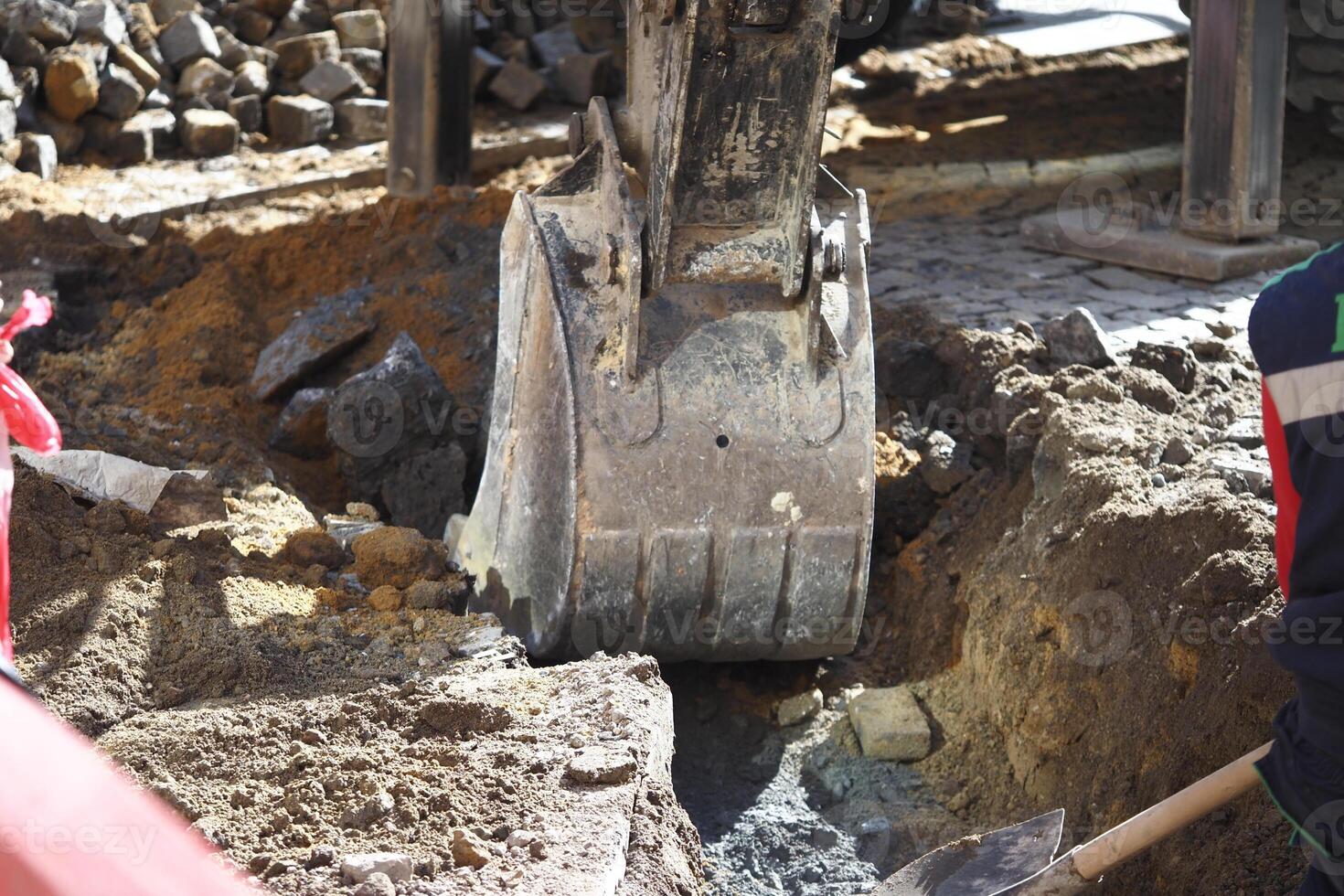 Excavation work in progress at a construction site during daylight photo