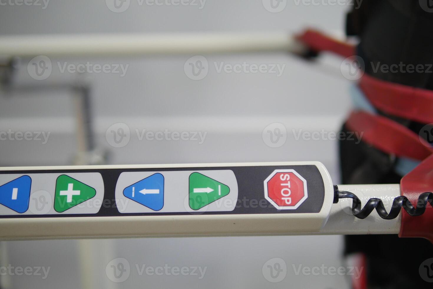 Control panel with stop and navigation buttons in use at facility photo