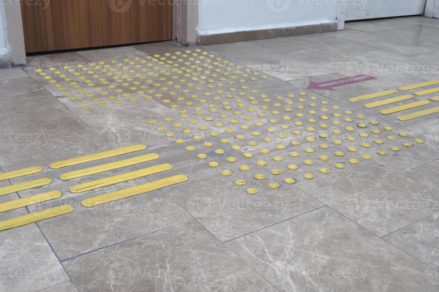 Textured surface markings guide safe movement in public space photo