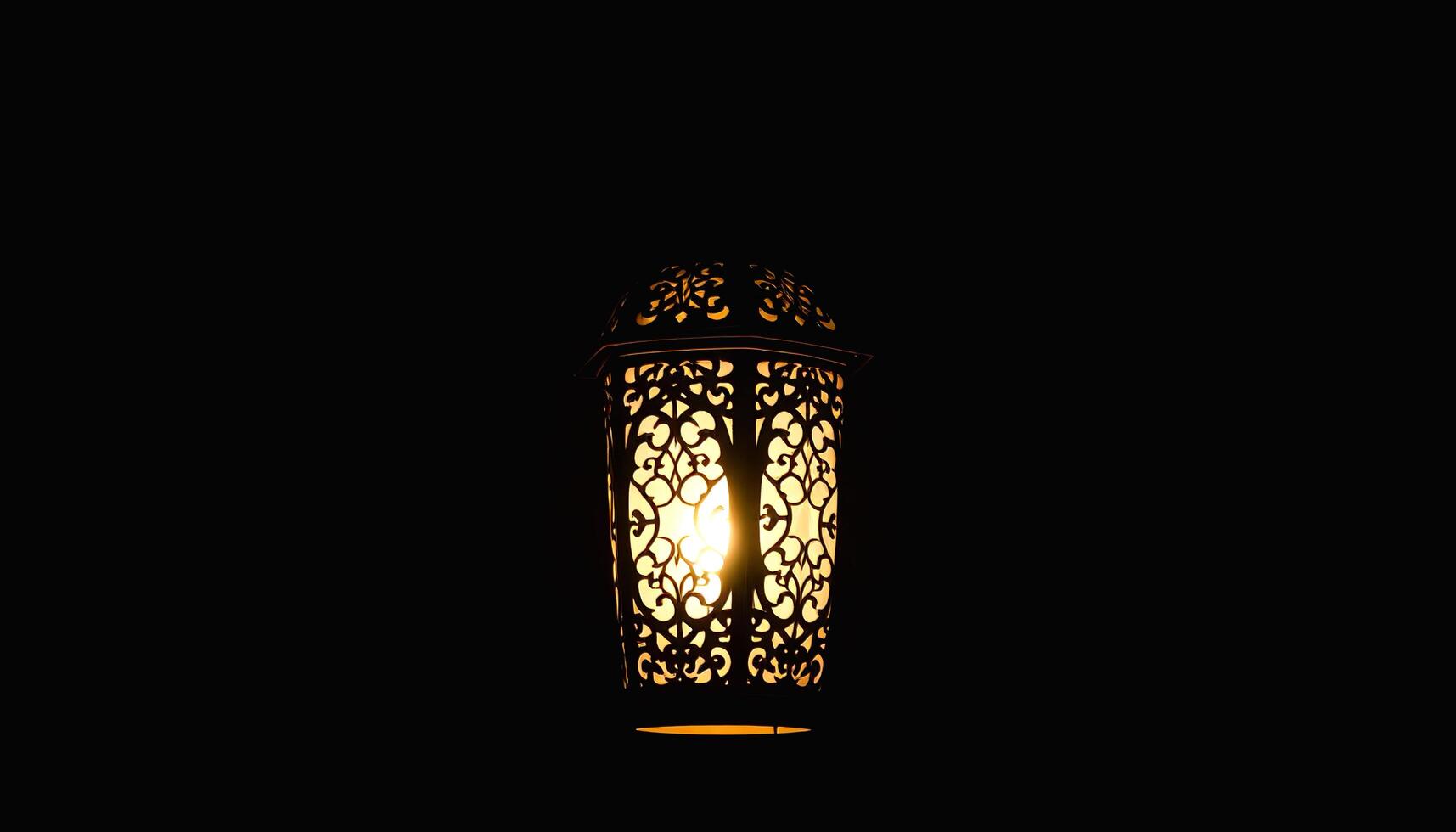 a lamp with a light shining through it photo