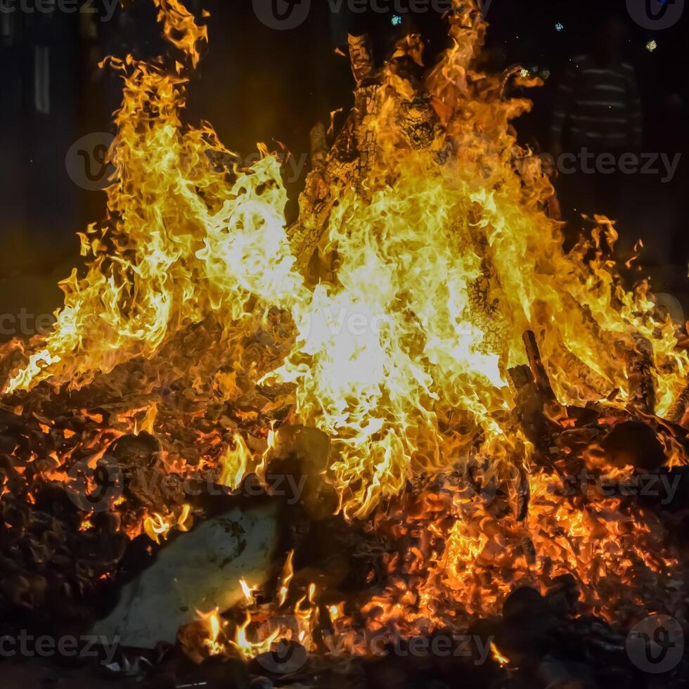 A bonfire is burning in the middle of the street photo