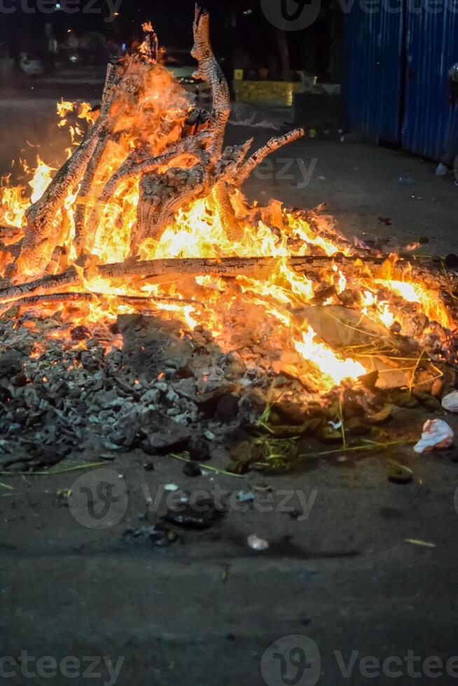 A bonfire is lit on the street photo