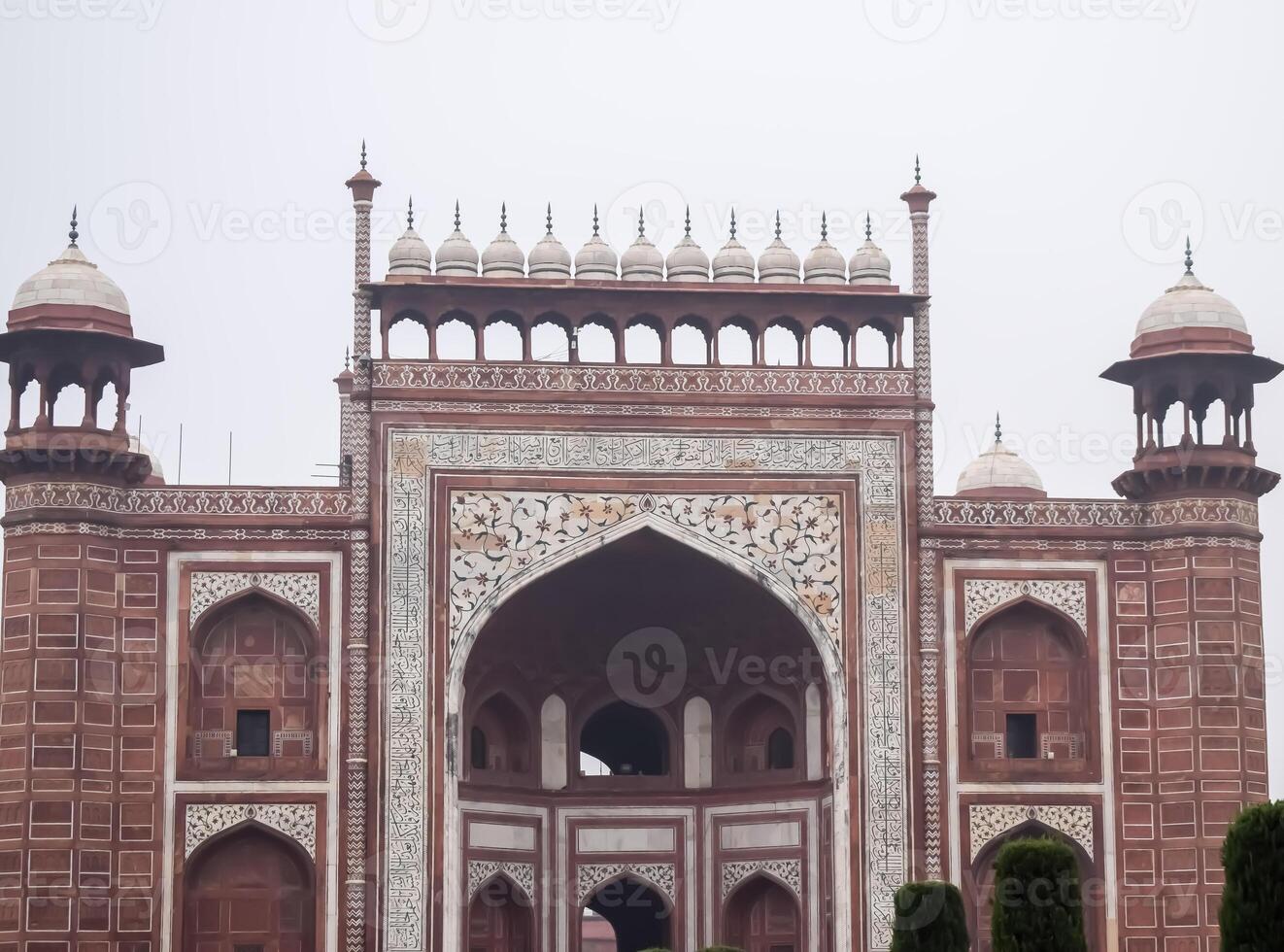 The taj mahal is a beautiful building with many arches photo