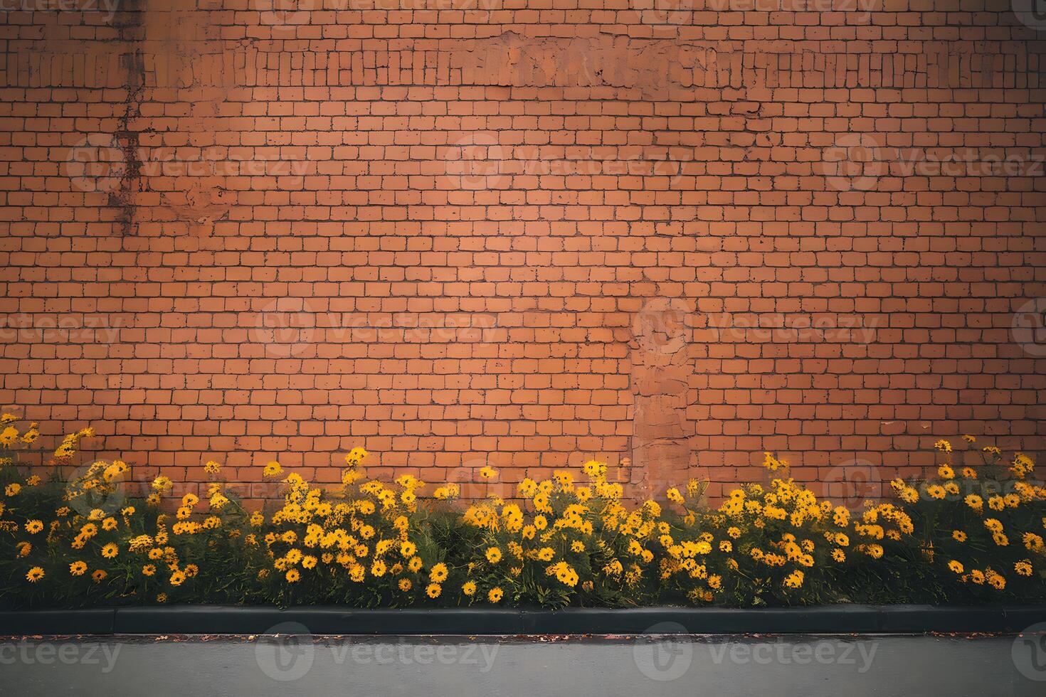 A brick wall with yellow flowers photo